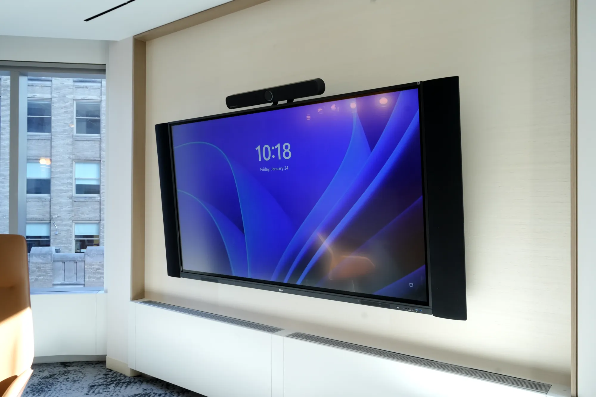 Meeting room display with a video bar at 3 Times Square