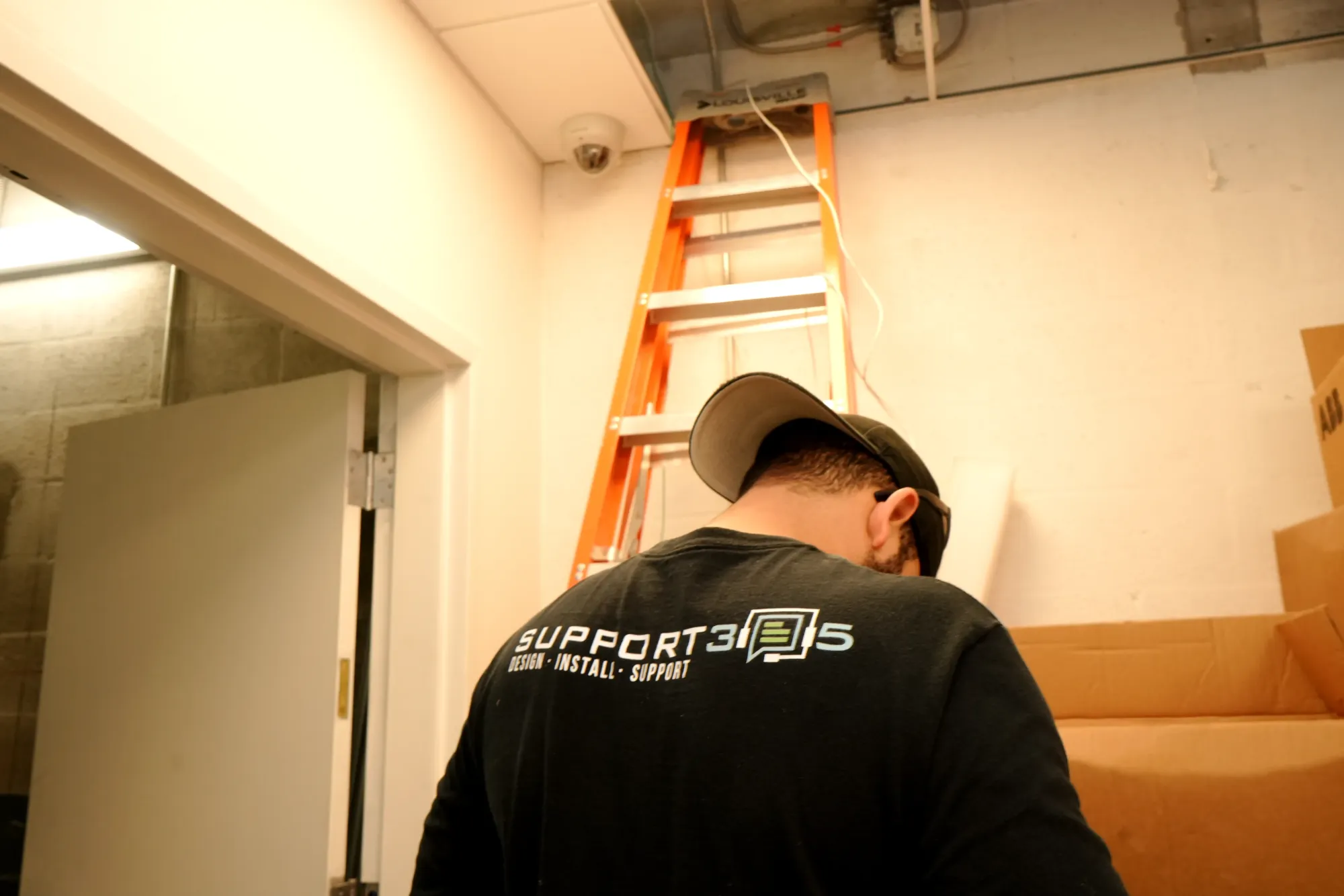 Dome camera installed above a corridor door
