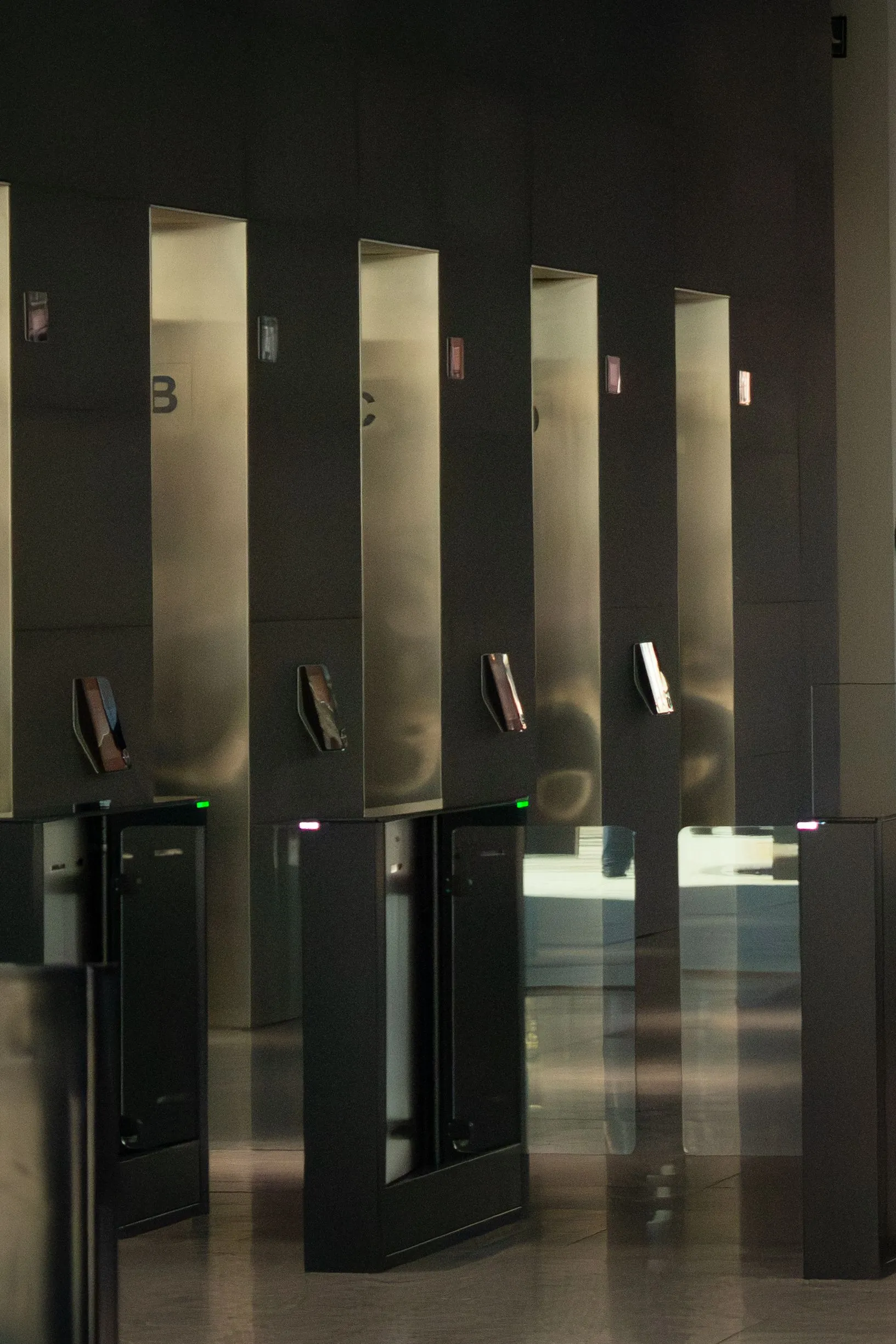 Speed gate turnstiles in a modern office lobby