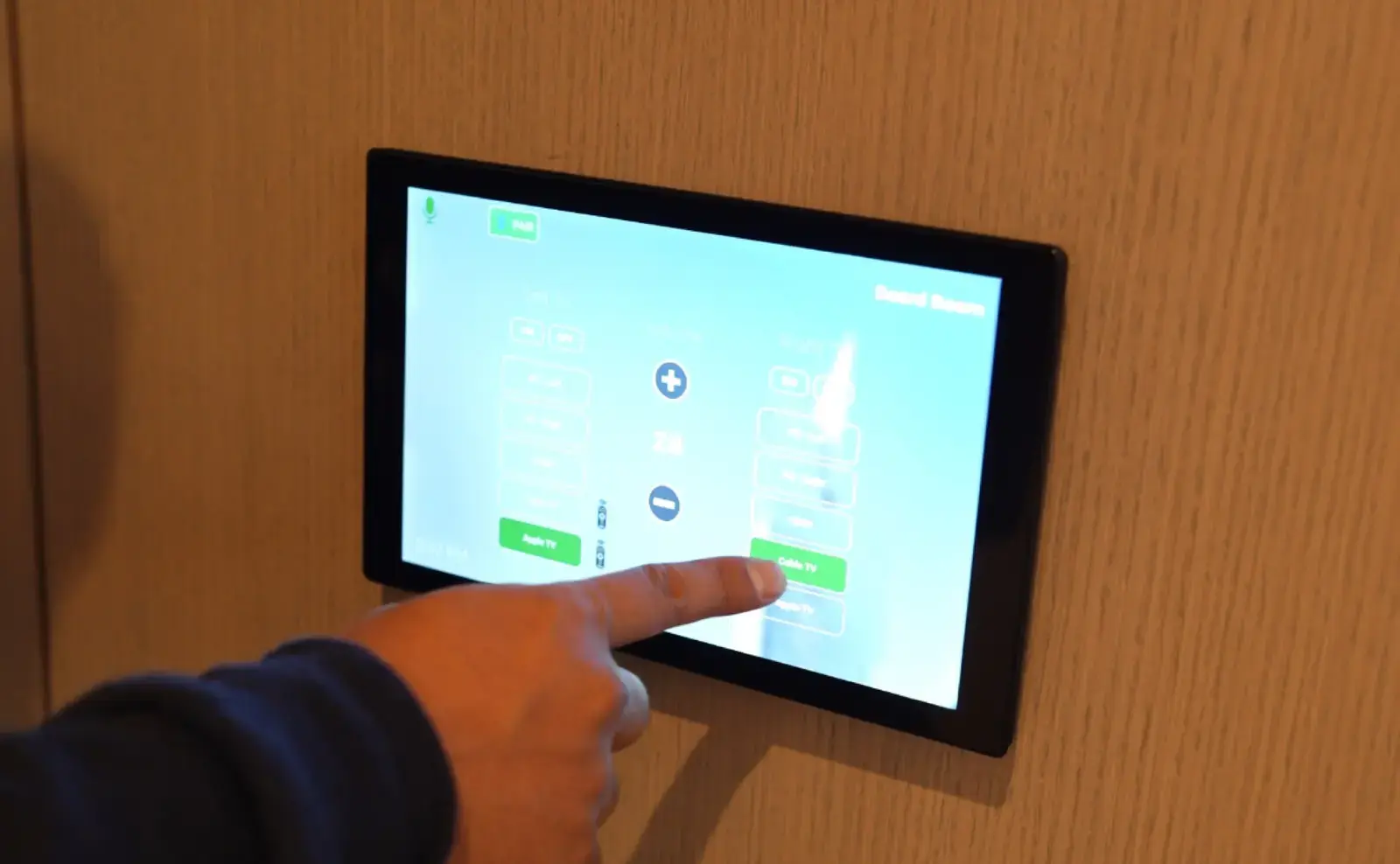Wall-mounted touch panel controlling a room
