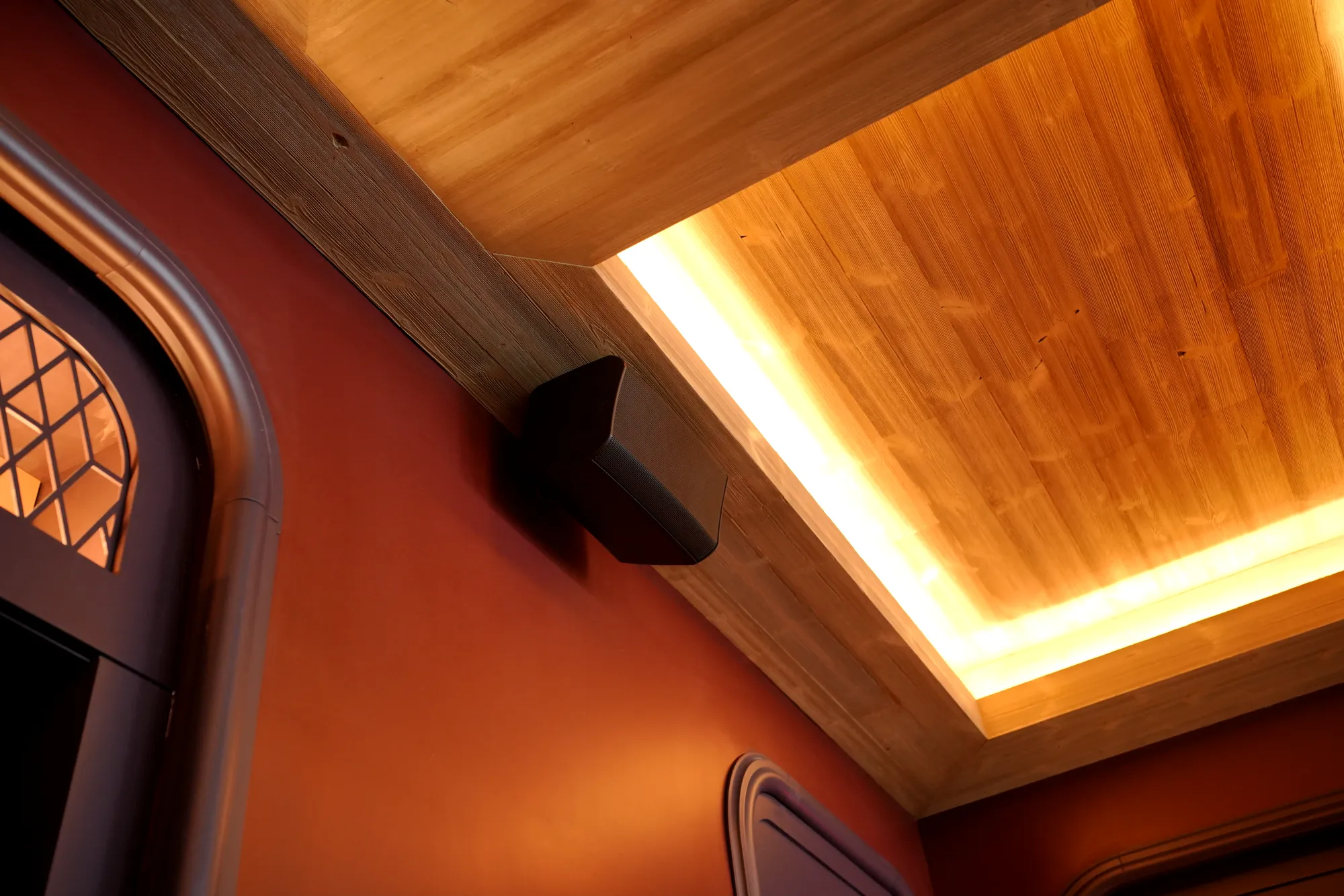 Loudspeaker in a restaurant with a wood ceiling